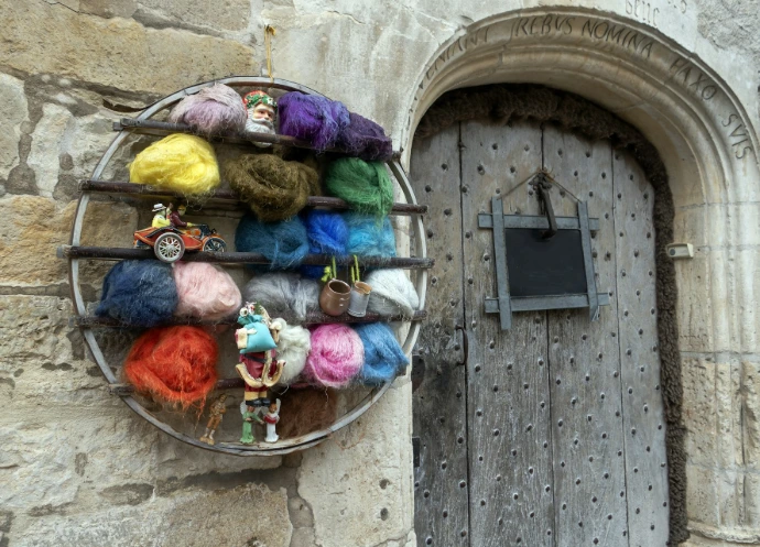 a group of people in clothing outside a door